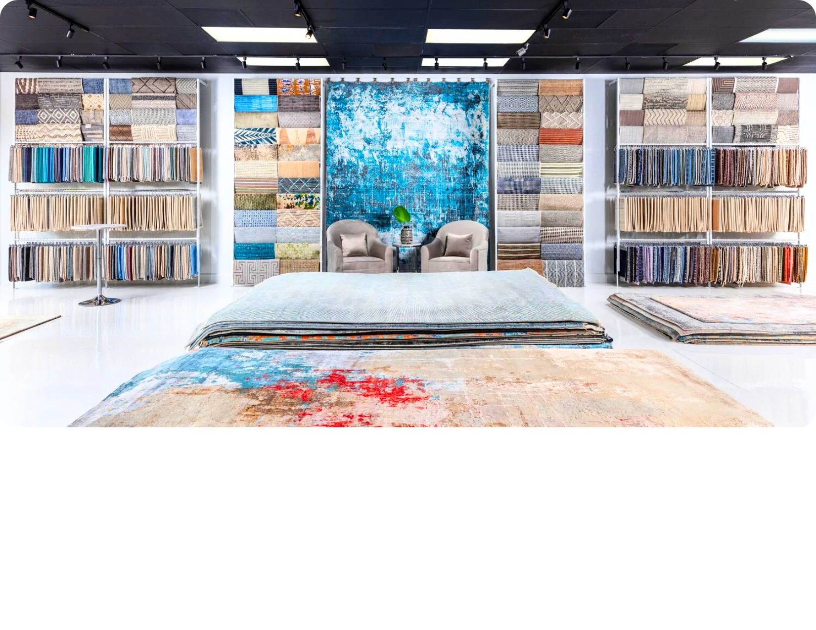 Rugs and carpet samples displayed in the Custom Floors Design showroom